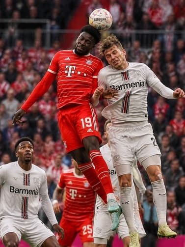 football_players_in_red_and_white_jerseys_competing